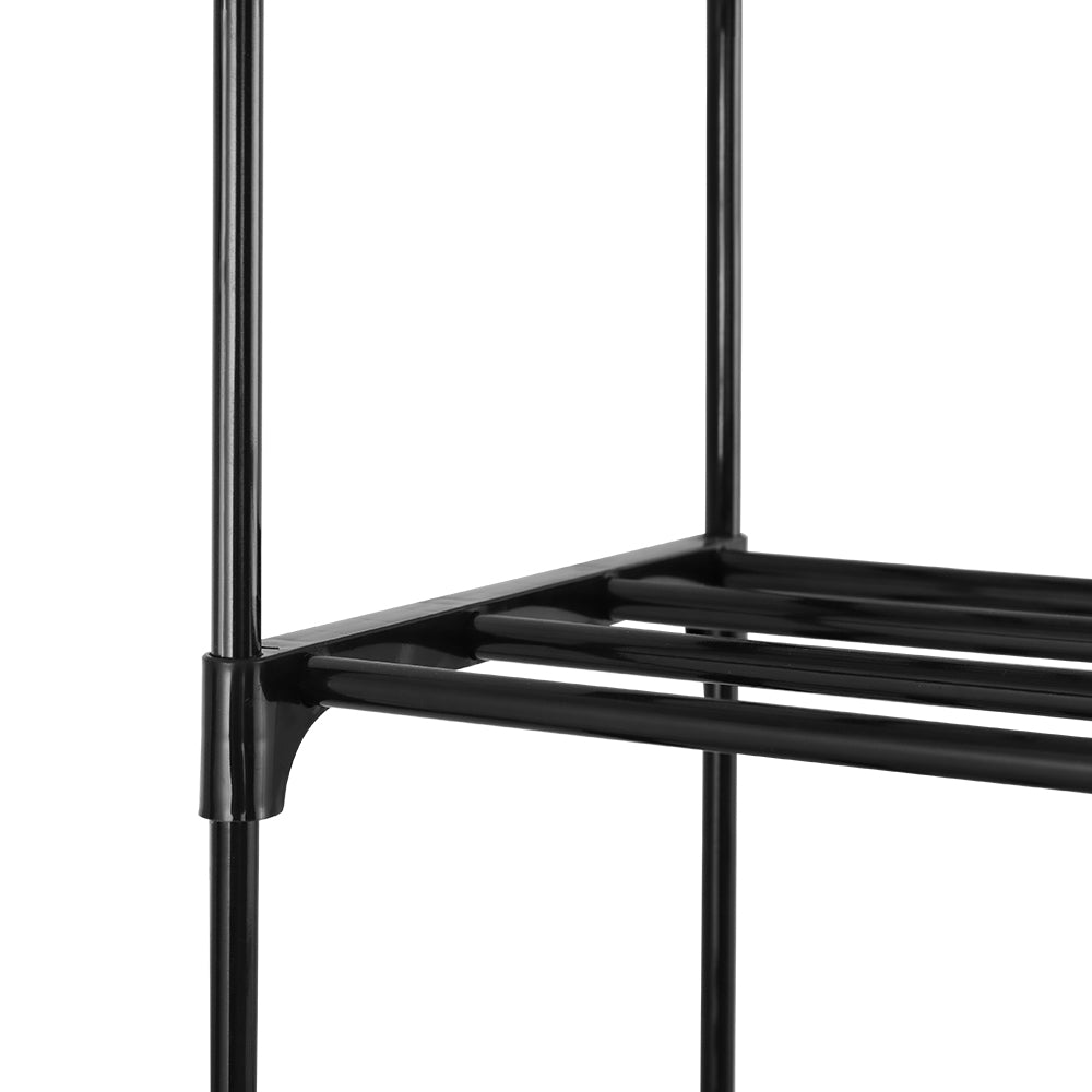 Close-up of wire shelf bracket connector meeting black tube frame pole on narrow shoe rack on white background