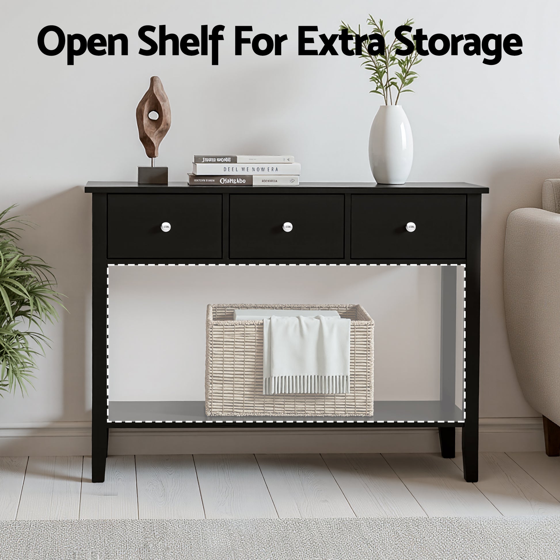 Black console table with text "Open Shelf For Extra Storage", lower shelf holding rattan basket with white throw
