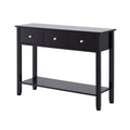 Black console table with three drawers, chrome knobs and lower shelf, three-quarter angle view on white background