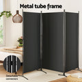 Black 3-panel fabric room divider metal tube frame in bedroom lifestyle with detachable connectors close-up