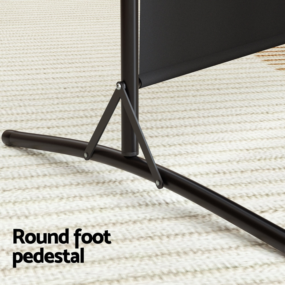 Black 3-panel fabric room divider round foot pedestal close-up on cream rug with black T-bar base and triangular brace