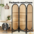 Black 3-panel arched rattan room divider bedroom lifestyle with paulownia wood frame and two-way metal hinges callout