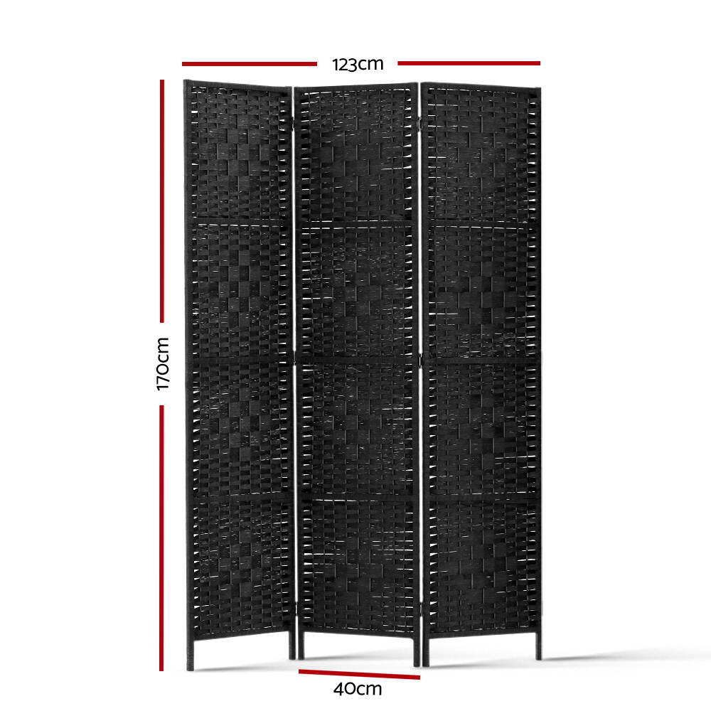 Black 3-panel woven paper rope room divider in Scandinavian lifestyle with rattan pendant lamp white dining chair and shelves