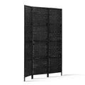 Black 3-panel woven paper rope room divider folded compact storage side view on white background with gold hinges visible