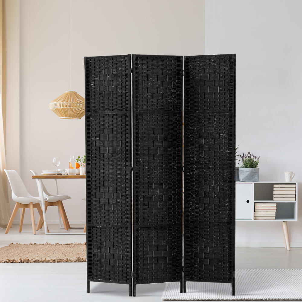 Black 3-panel woven paper rope room divider in Scandinavian lifestyle with rattan pendant lamp white dining chair and shelves