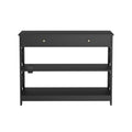 Black console table front view, one drawer, X-cross panels, two lower shelves and power outlet on middle shelf
