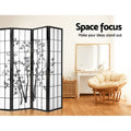 Black 4-panel bamboo print shoji room divider in lifestyle room with papasan rattan chair and white dressing table mirror