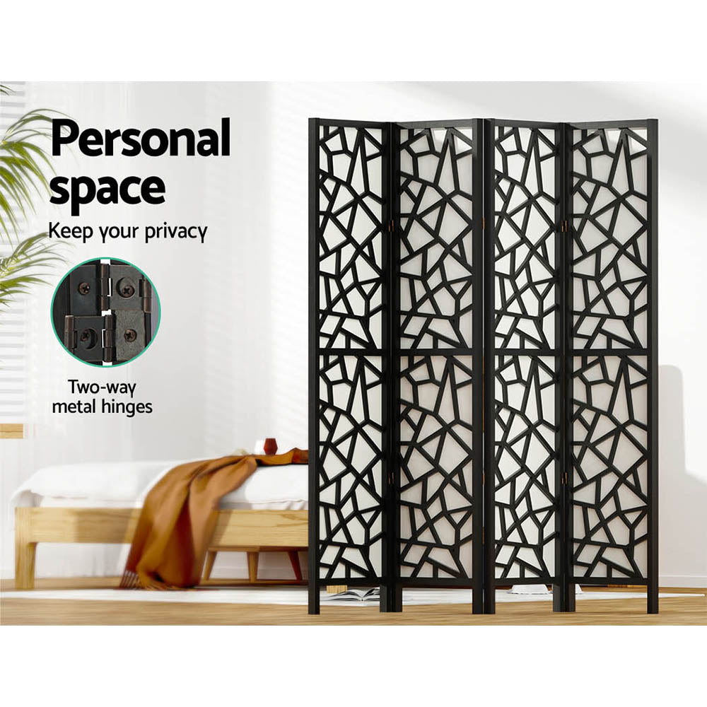 Black 4-panel criss-cross geometric room divider in bedroom lifestyle with personal space and two-way metal hinges callout