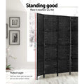 Black 4-panel woven paper rope room divider 170cm height infographic in lifestyle room with framed wall photos and orchid