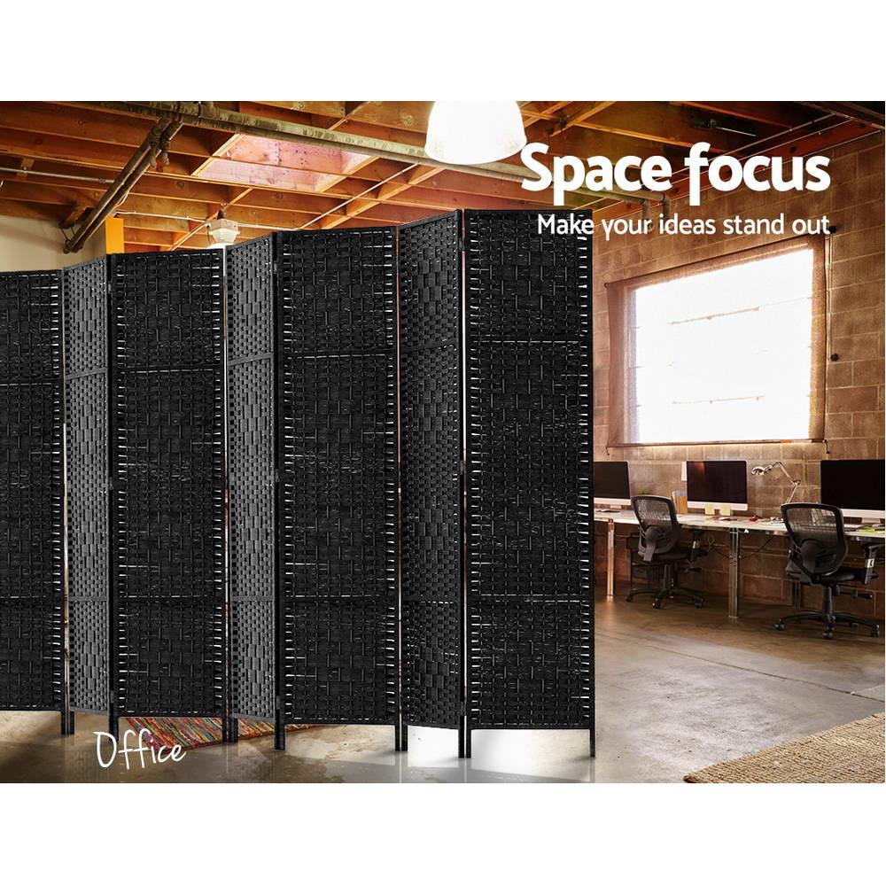 Black 4-panel woven paper rope room divider in industrial office lifestyle with exposed ceiling beams and computer desks