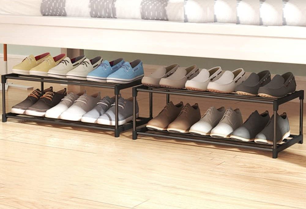 Two 2-tier black tube shoe racks under bed loaded with loafers and casual shoes side by side