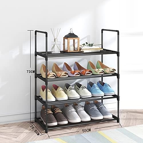 Black 4-tier metal tube shoe rack 55cm in hallway with colorful flats and loafers, lantern and decor on top