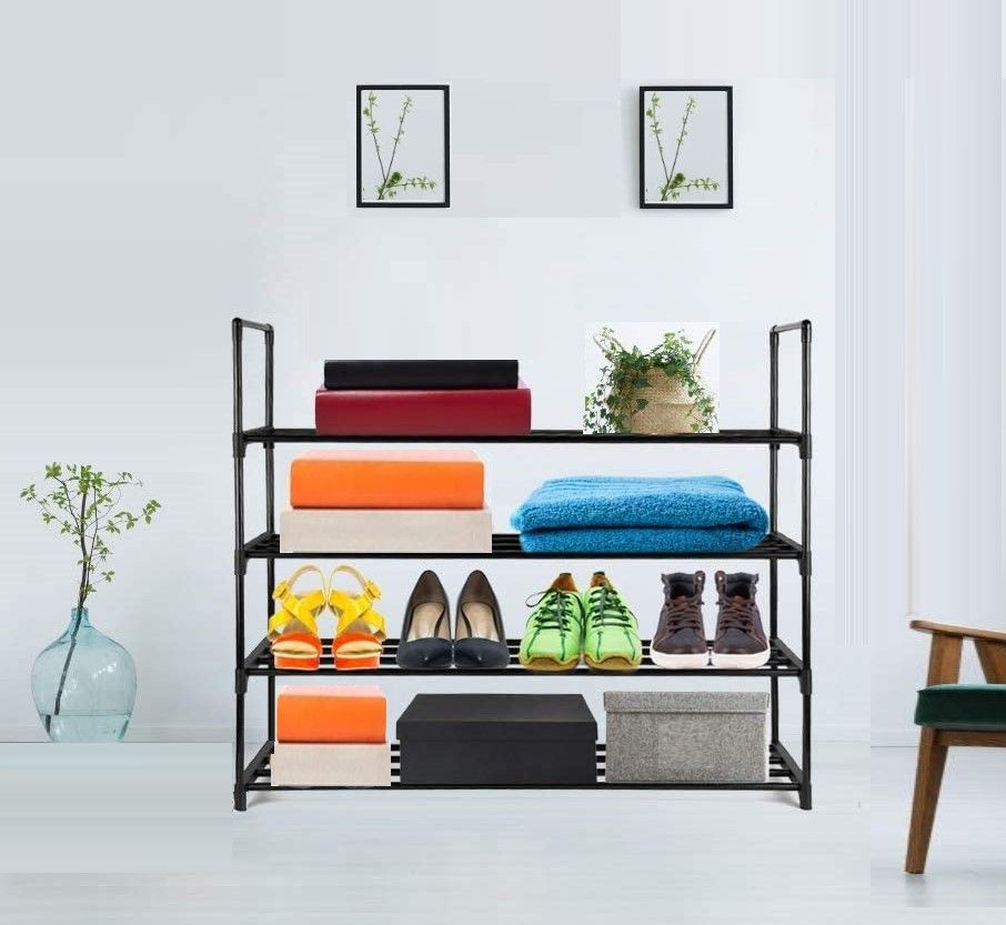 Black 4-tier tube rack used as multi-purpose shelf with shoe boxes, folded linens and towels in room