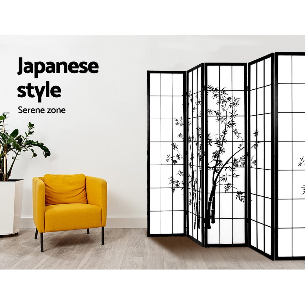 Black 6-panel bamboo print shoji room divider in living room lifestyle with yellow armchair and ZZ plant against white wall