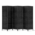 Black 6-panel woven paper rope room divider flat front view on white background with black woven panels and wood feet