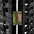 Black 6-panel woven paper rope room divider gold hinge close-up between two black woven panels on black wood frame