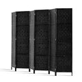 Black 6-panel woven paper rope room divider arc open configuration on white background with black woven panels