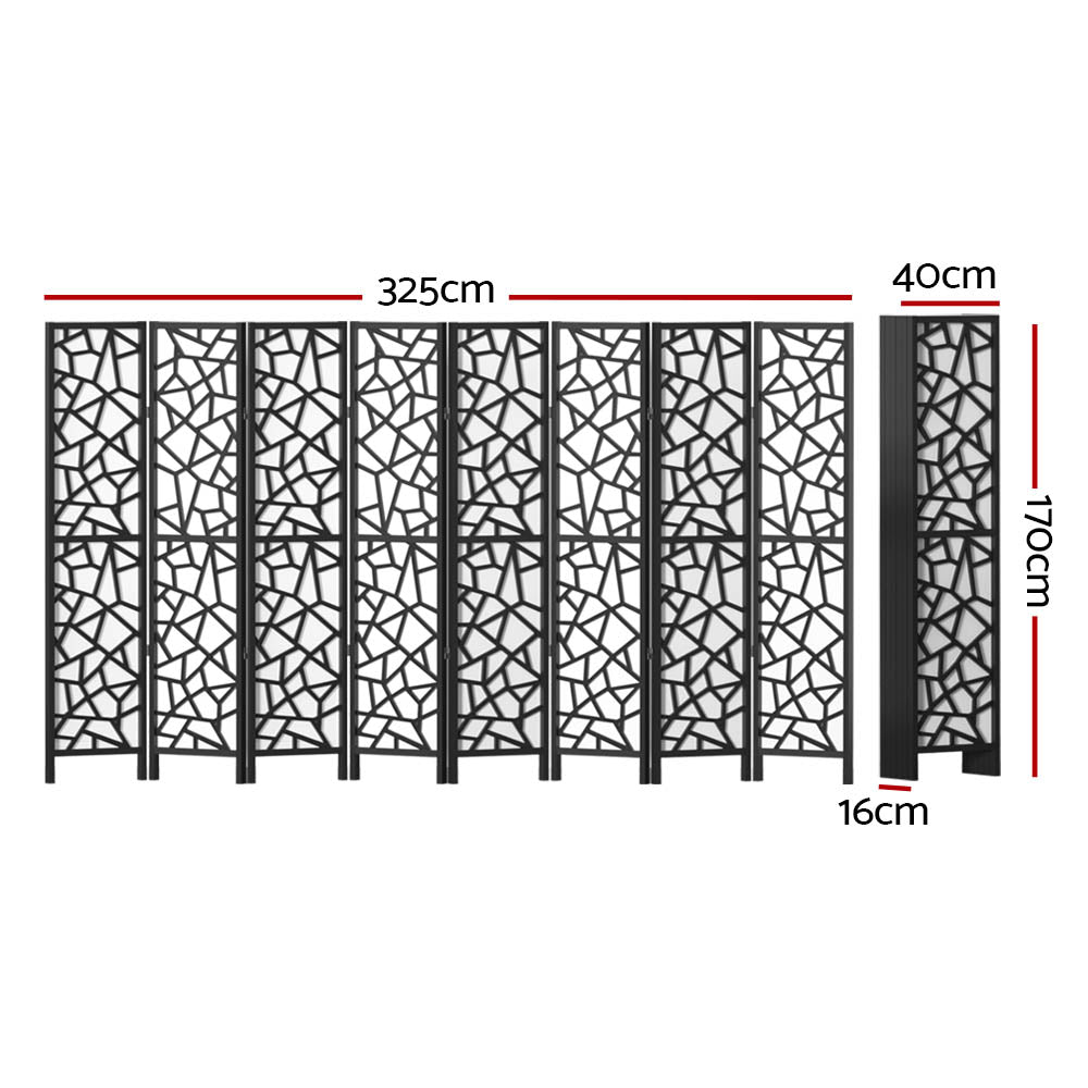 Black 8-panel MDF room divider with geometric star pattern cutouts in lifestyle room with chair and ottomans