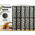 Black 8-panel geometric MDF room divider personal space lifestyle with pine bed and two-way metal hinges callout