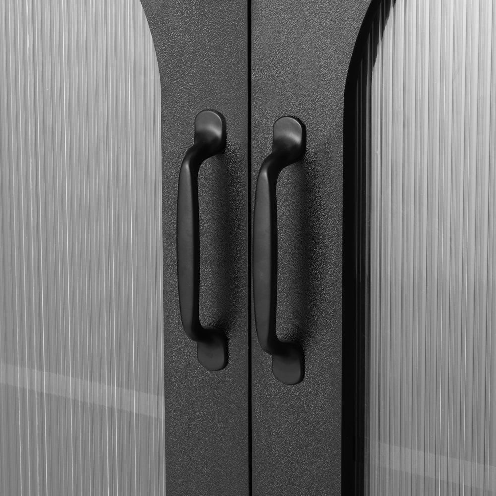 Close-up of two black bar pull handles on the upper arched glass cabinet doors, fluted glass panels on either side