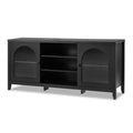 Black sideboard with two arched fluted glass doors flanking open central bay with two shelves, on tapered legs