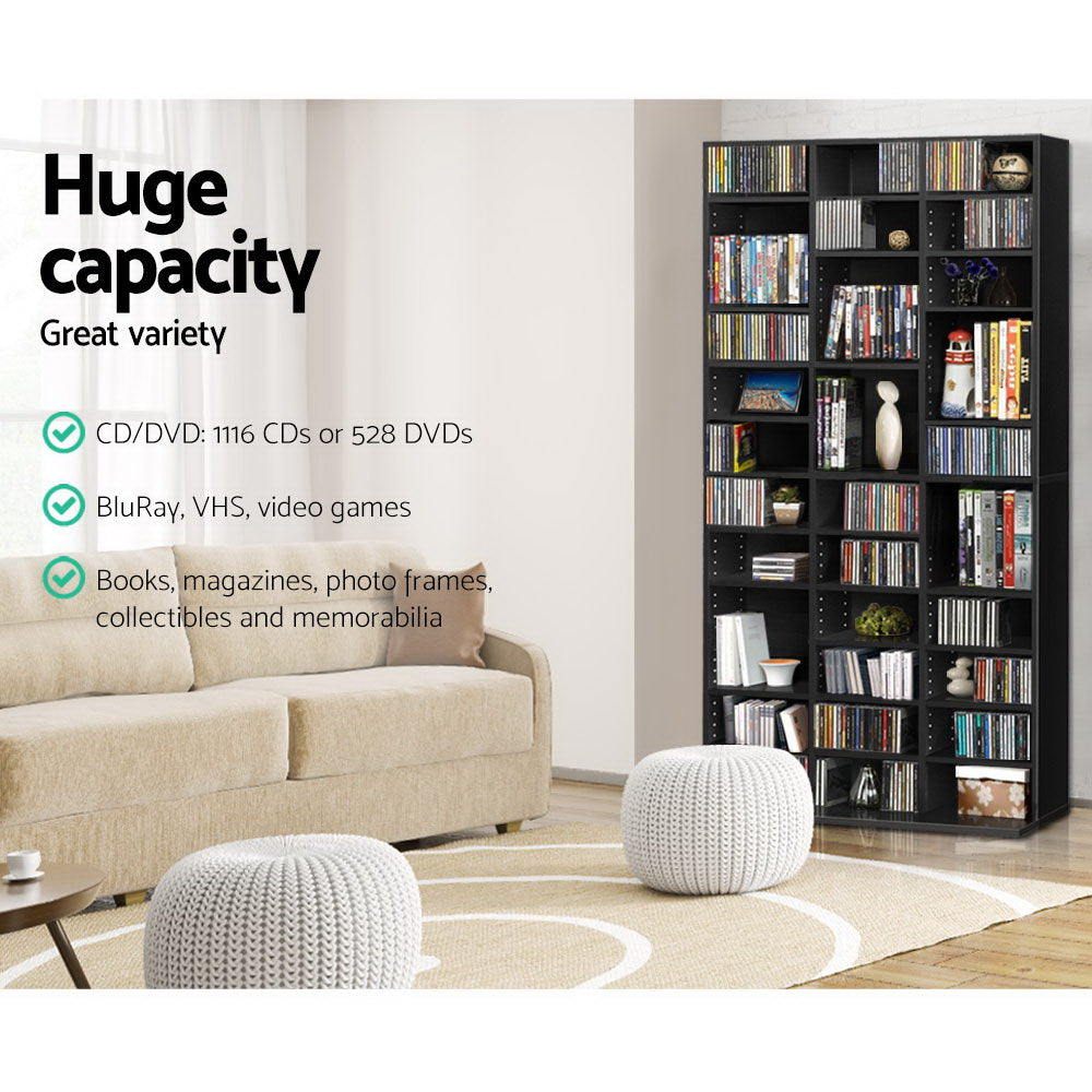 Black media storage shelf in living room, text: holds 1116 CDs or 528 DVDs, BluRay, VHS, video games