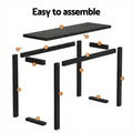 Black console table exploded assembly diagram with parts labelled A to G, text 
