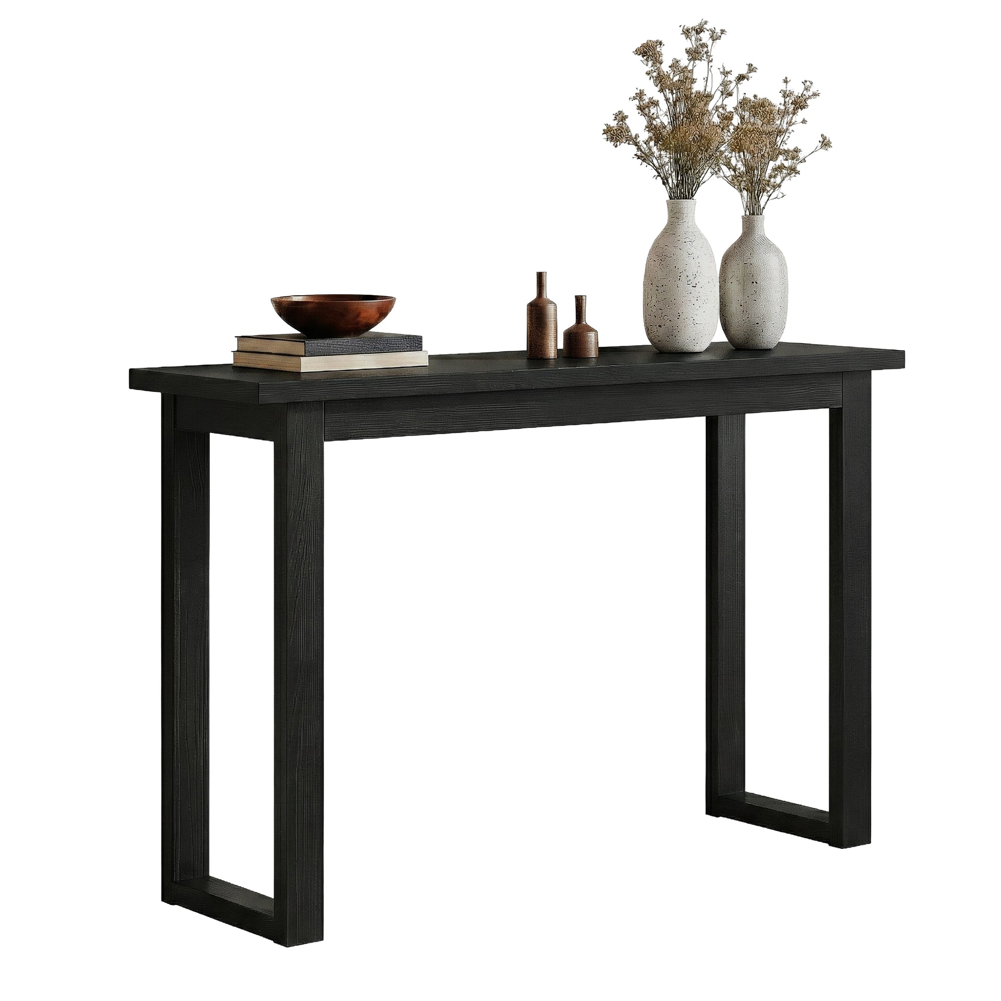 Black console table with U-sled frame legs styled with bowl, dried flower vases and small decorative bottles, angle view