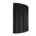 Black room divider curtain hanging on white curved ceiling track on white background