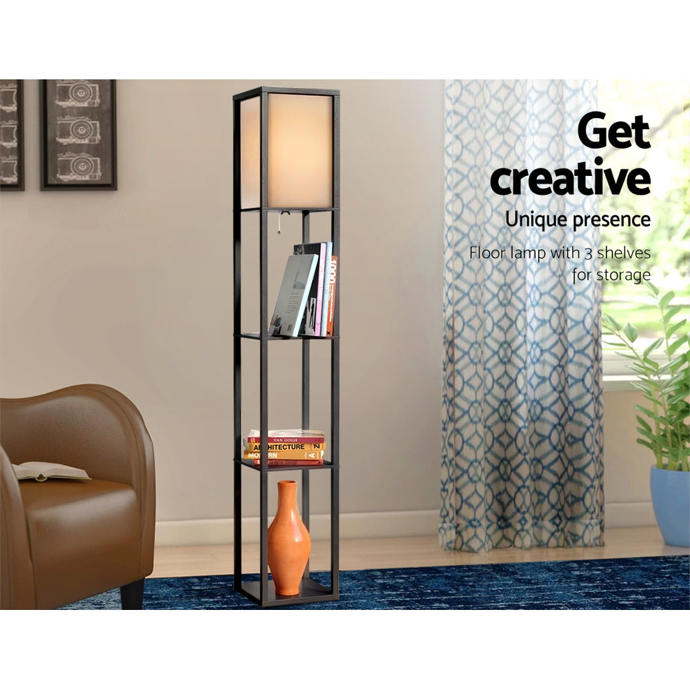 Black shelf floor lamp in lounge setting with books and orange vase on shelves, text overlay Get creative