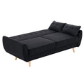 Black fabric sofa bed fully extended flat showing tufted seat and conversion mechanism on white background