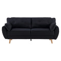 Front view of black fabric rounded-arm sofa bed with two button-tufted scatter pillows on white background