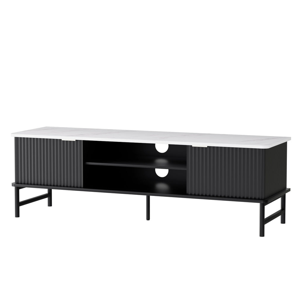 Black fluted TV unit marble top angle view on white two sliding fluted doors center open shelves cable holes and metal legs