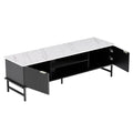 Black fluted marble-top TV unit angle view both sliding doors open showing two interior shelves on white background