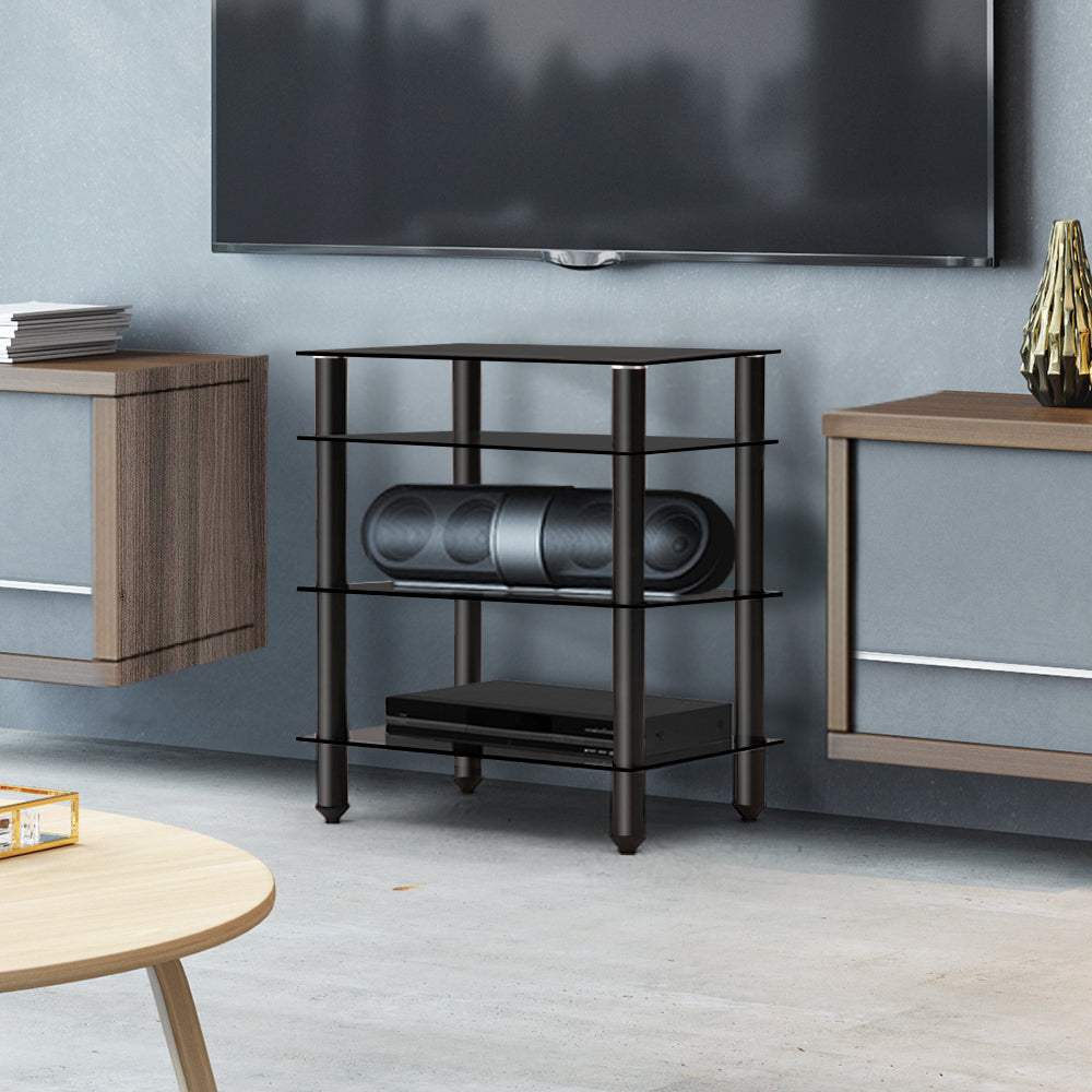 Black 4-shelf glass and metal HiFi AV rack lifestyle in blue-grey room with Bluetooth speaker and media player