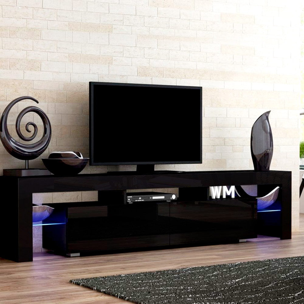 Black glossy LED TV unit 200cm lifestyle in brick-walled room with WM letter sculptures and disc player