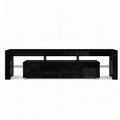 Black glossy LED TV unit 200cm front view on white background two centre push-open drawers and glass shelf