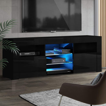 Black glossy LED TV unit 160cm in living room with blue LED lit shelves and wall-mounted TV above