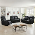 Black leather reclining furniture set in modern living room with coffee table and wall art