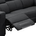 Close-up of black leather recliner seat with extended footrest mechanism showing faux leather upholstery