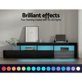 Black LED TV unit 215cm in living room with blue LED glow and 16 LED colour swatches, speakers on top