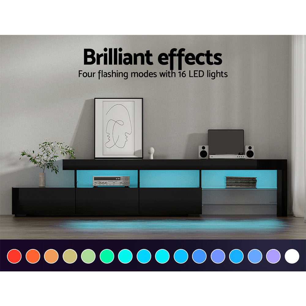 Black LED TV unit 215cm in living room with blue LED glow and 16 LED colour swatches, speakers on top