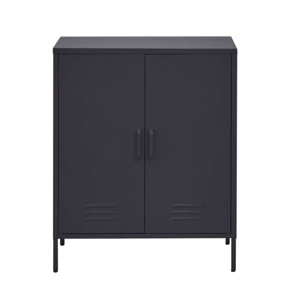 Black metal two-door locker-style cabinet with vent slots and bar handles on thin metal legs, front view on white background