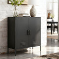Black metal two-door locker cabinet styled with stone lamp and vase on top against white brick wall in living room setting