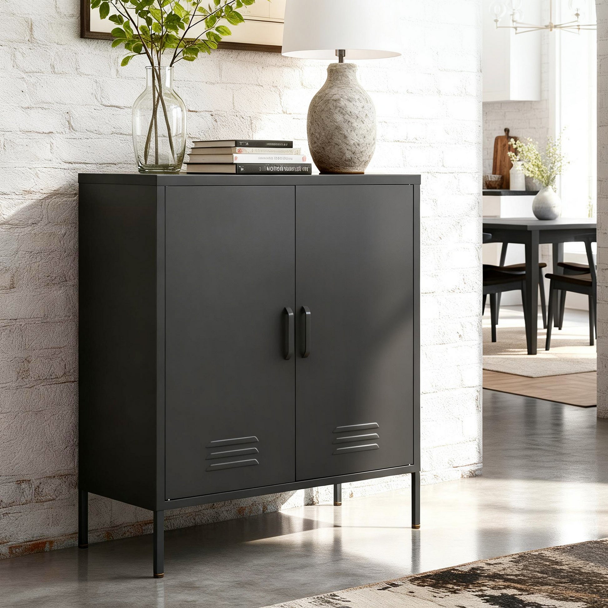 Black metal two-door locker cabinet styled with stone lamp and vase on top against white brick wall in living room setting