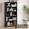 Black five-tier bookcase with books and decor in bright room; 20kg capacity per shelf, 15mm thick particle boards