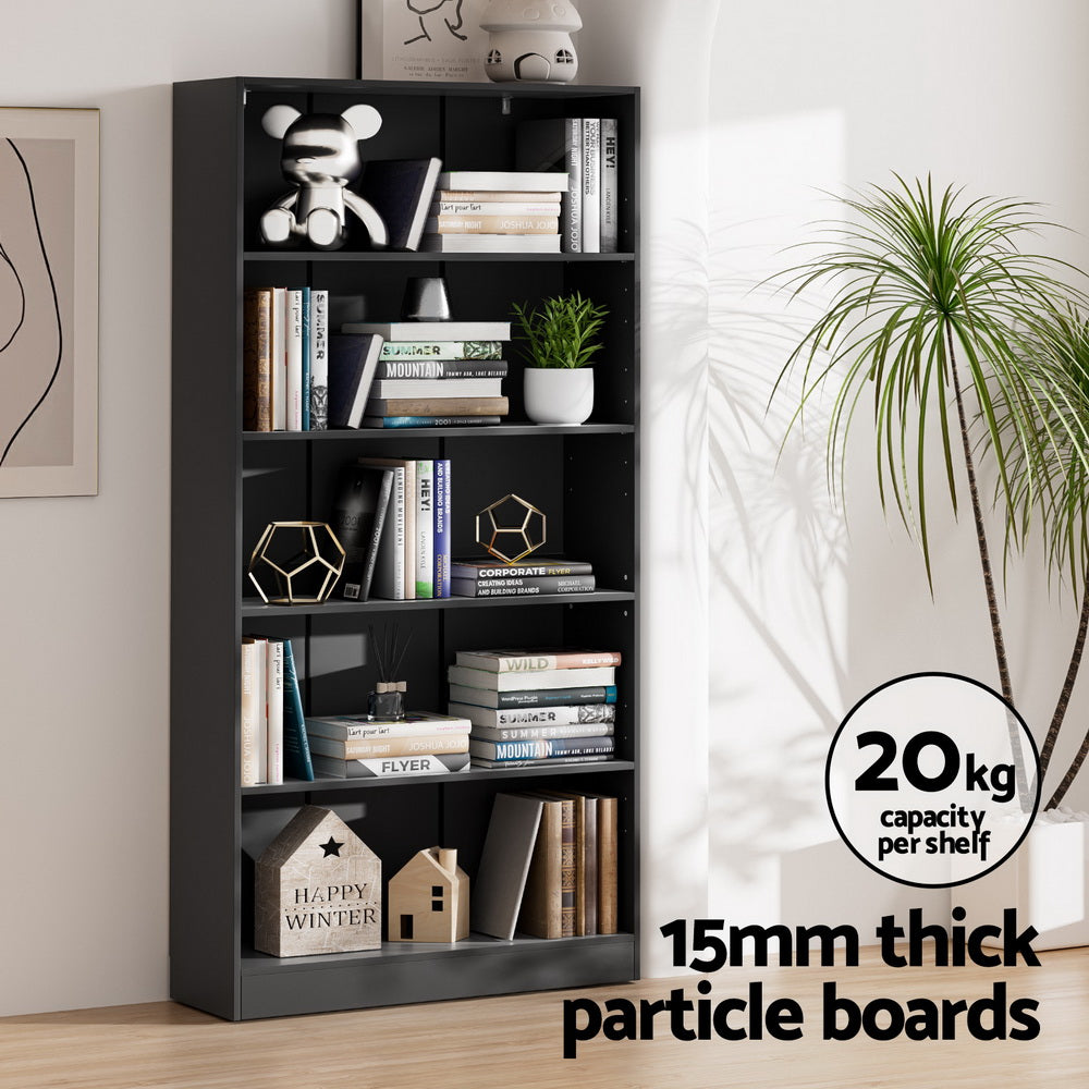 Black five-tier bookcase with books and decor in bright room; 20kg capacity per shelf, 15mm thick particle boards