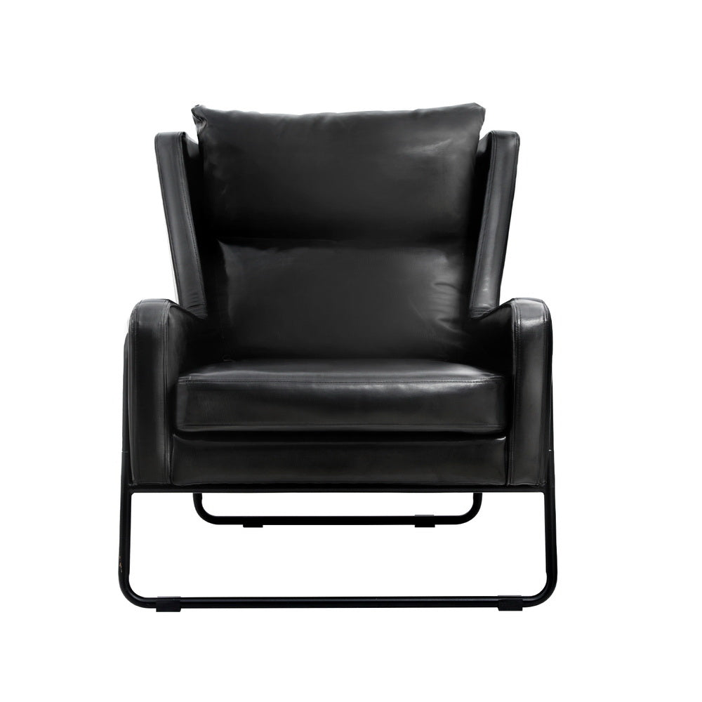 Black PU leather armchair with winged back, padded seat, and black metal sled base frame, front view on white background