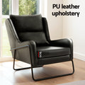 Black PU leather armchair by window with 