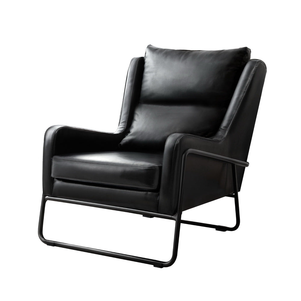 Black PU leather armchair with wing back cushion and black metal sled frame armrests, three-quarter view on white background